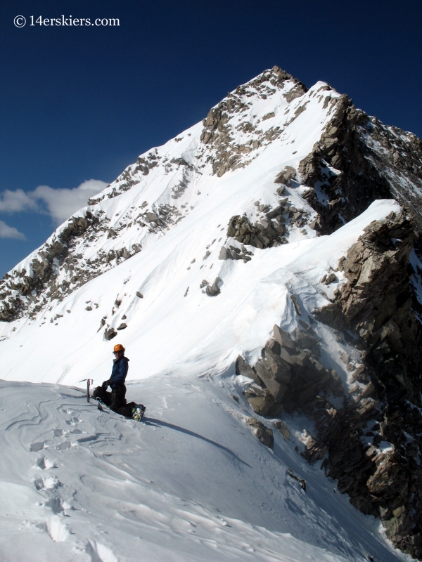 Jarrett Luttrell transitioning resting before taking on the final push to the summit of Capitol, his last fourteener to snowboard.  