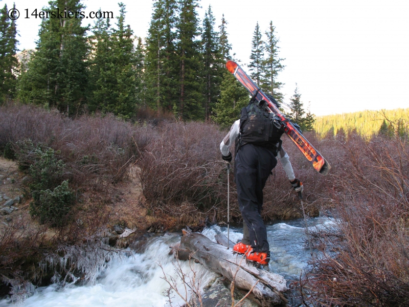 Frank Konsella using crampons to cross stream. 