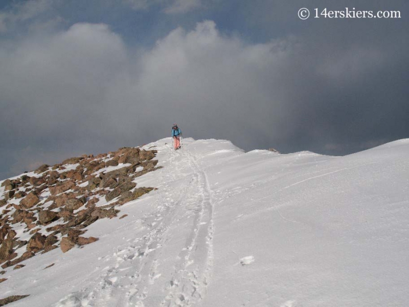 Brittany Walker Konsella backcountry skiing from summit of Mt. Bierstadt.