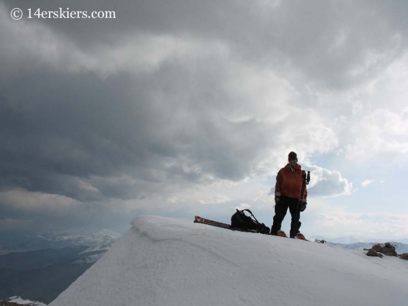 Frank Konsella on the summit of Mt. Bierstadt getting ready to ski.