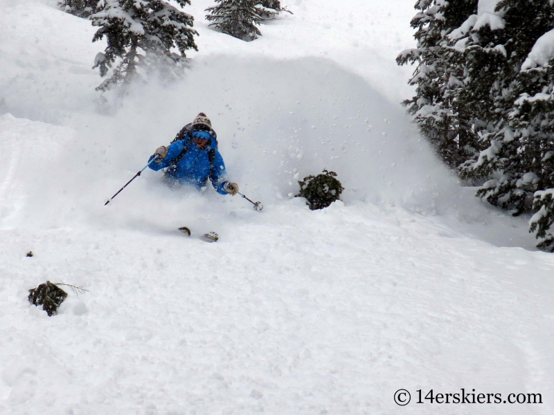 Dave Bourassa getting powder while backcountry skiing in Crested Butte.