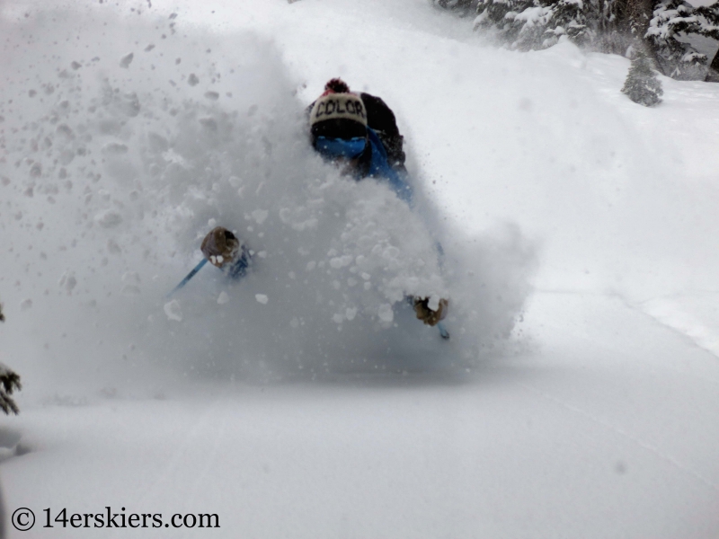 Dave Bourassa getting powder while backcountry skiing in Crested Butte.