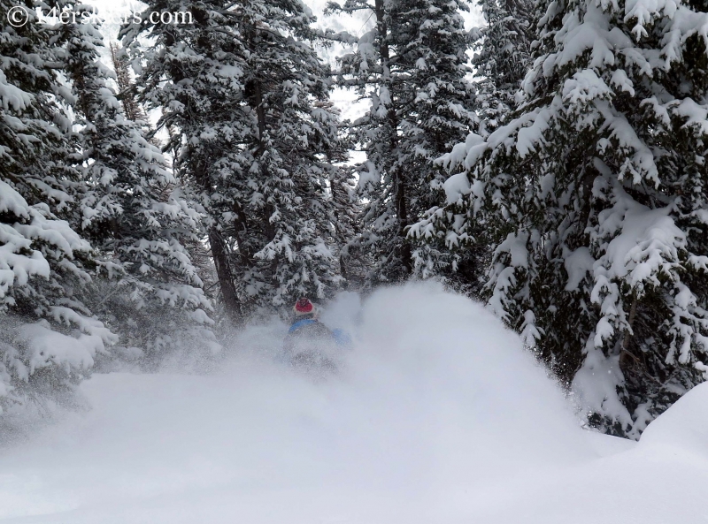 Dave Bourassa getting powder while backcountry skiing in Crested Butte.
