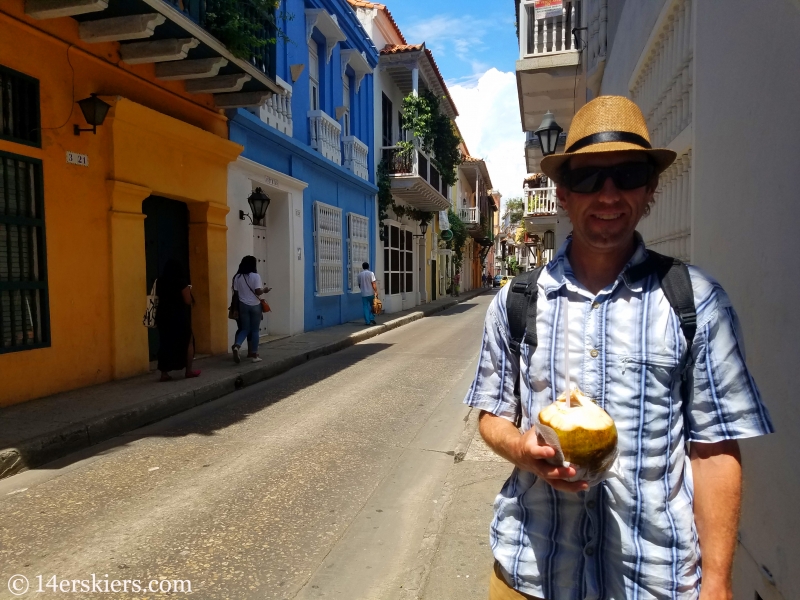 Enjoying coconut on the streets of colorful Cartagena.