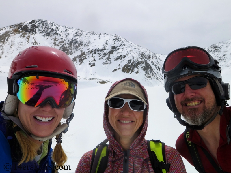 Brittany Walker Konsella, Natalie Moran, and Scott Edlin smiling after backcountry skiing the north face of Crystal Peak.