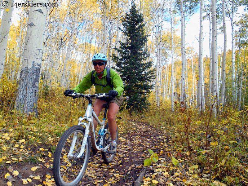 Susan Mol enjoying the downhill during a fall ride on the Dyke Trail near Crested Butte, CO