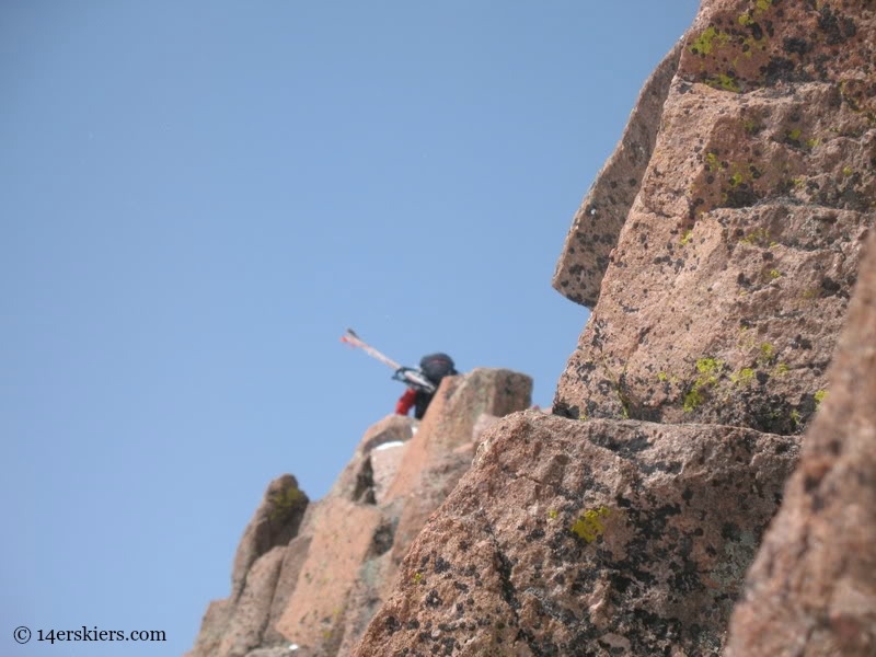 Climbing Mount Eolus to go backcountry skiing.