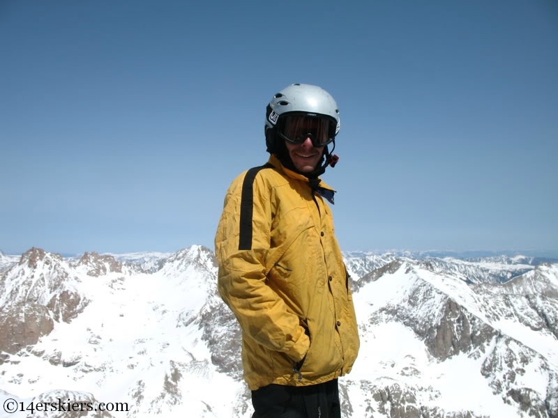 Jarrett Luttrell on the summit of Mount Eolus to go backcountry snowboarding.