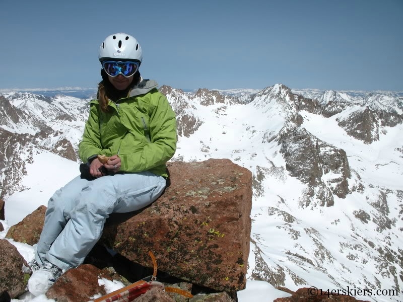 Brittany Walker Konsella on the summit of Mount Eolus.