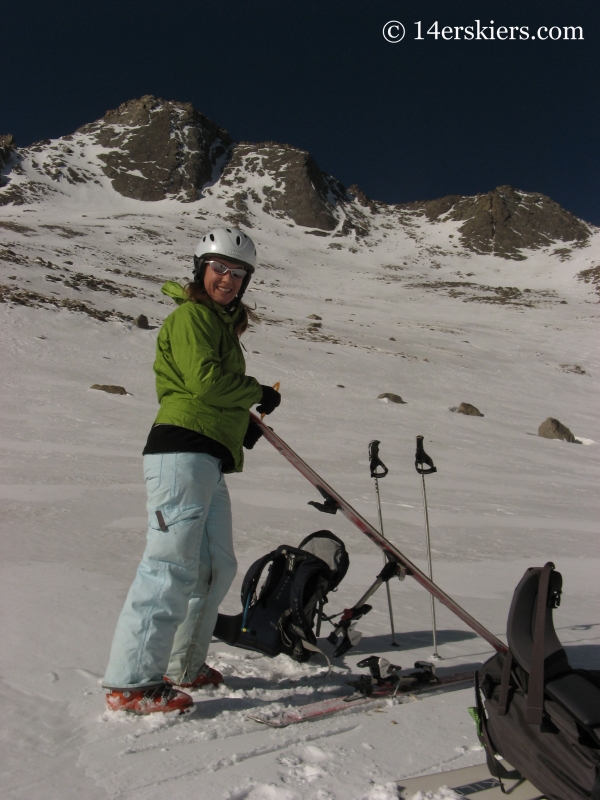 Brittany Konsella putting skins on to ski Mount Evans.