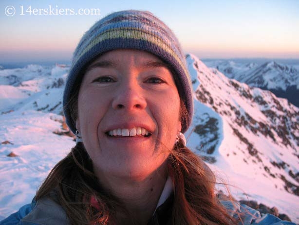 Brittany Walker Konsella on summit of Grays Peak, getting ready to backcountry ski. 