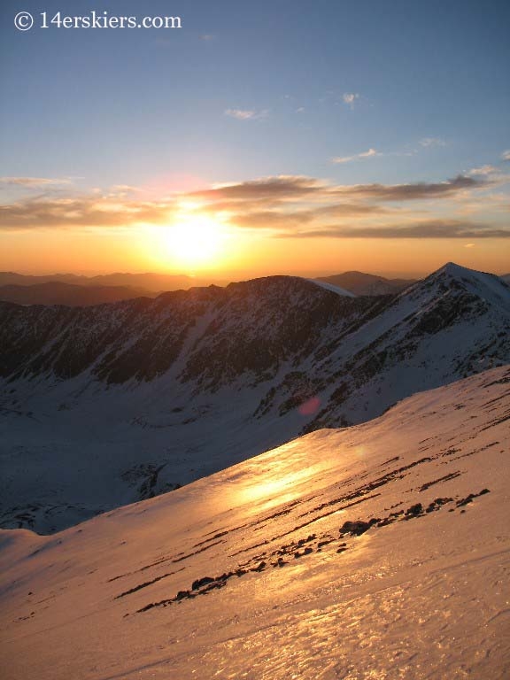 Backcountry skiing on Grays Peak at sunrise. 