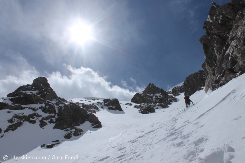 Climbing Grizzly Couloir to go backcountry skiing.  