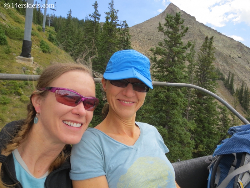 Natalia Moran and Brittany Konsella downloading on chairlift at Crested Butte. 