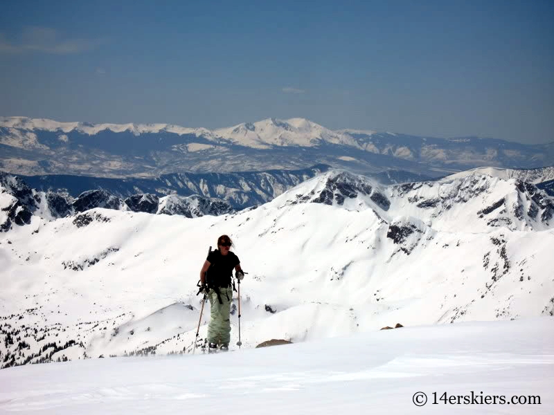 Kellie Baker skinning to ski Mount of the Holy Cross.