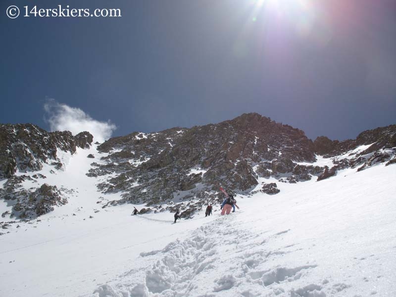 Climbing Mount Lindsey to go backcountry skiing. 