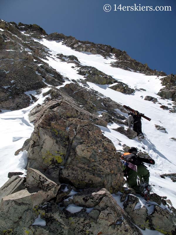 Climbing Mount Lindsey to go backcountry skiing.