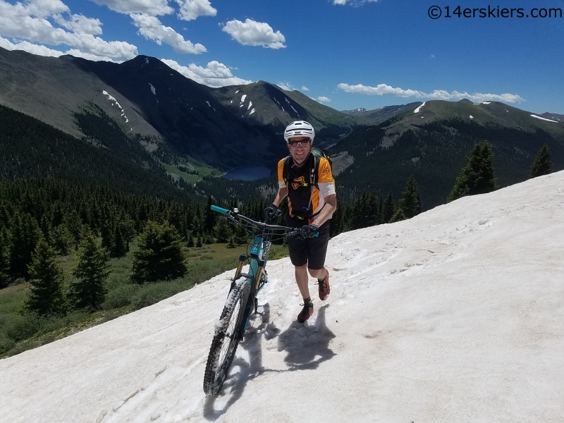 snowdrift on timberline trail with mirror lake in background