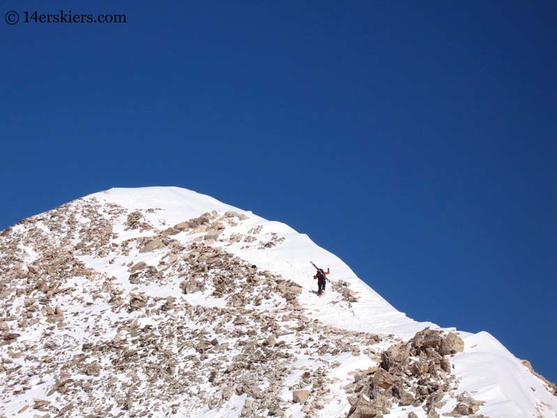 Frank Konsella climbing to go backcountry skiing on Mount Sherman.  