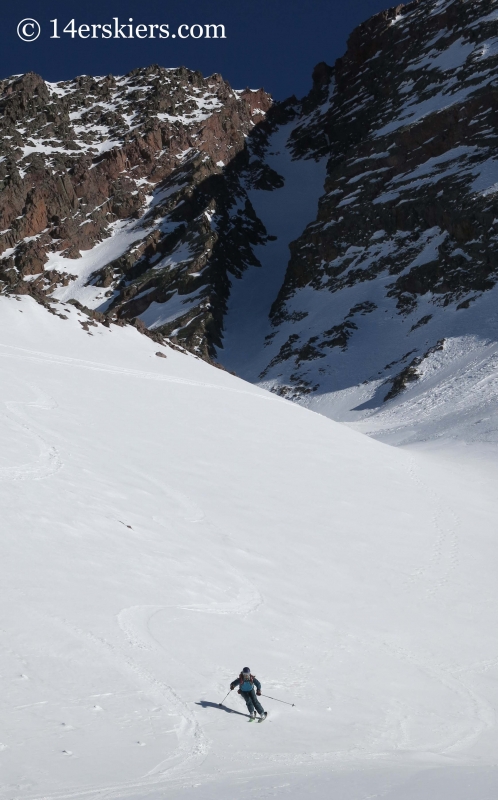 Brittany Konsella skiing with Naked Lady behind. 