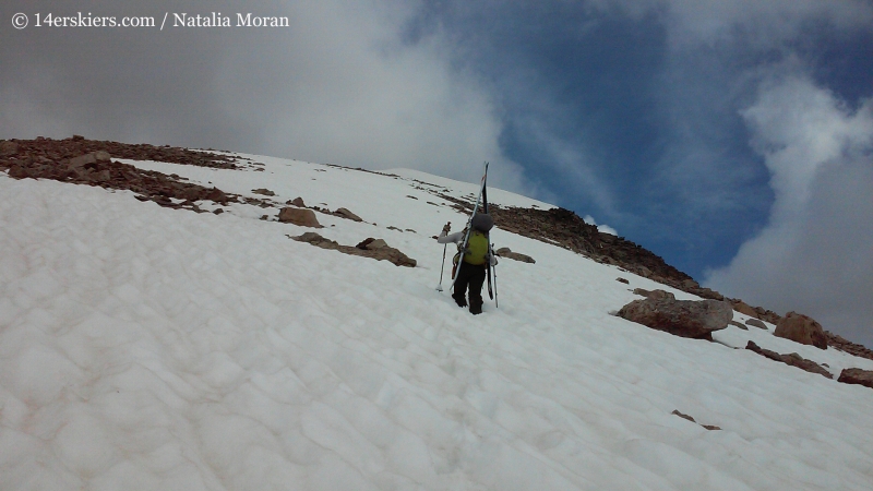 Brittany Konsella climbing Mount Oklahoma to go backcountry skiing. 