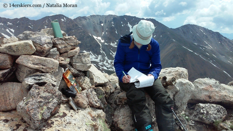 Signing the summit register on Mount Oklahoma.