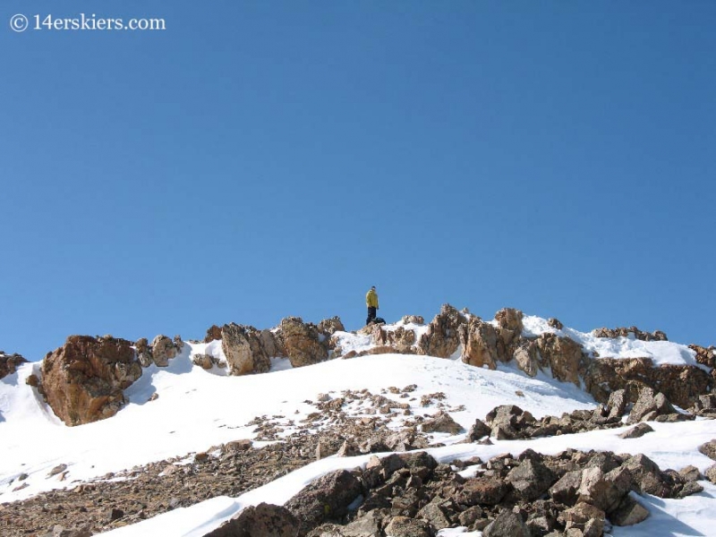 Frank Konsella on summit of Mount Belford getting ready to backcountry ski. 