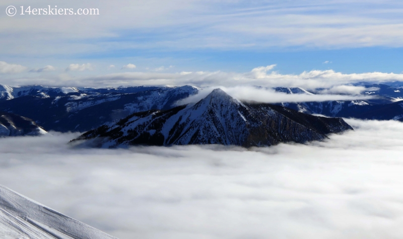 Mount Crested Butte with fog in winter seen from Red Lady while backcountry skiing in Crested Butte. 