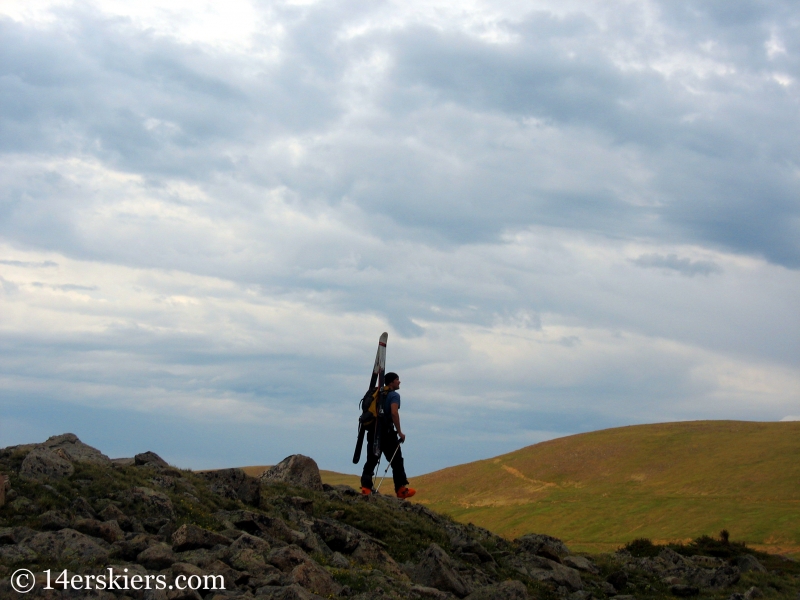 Dave Bourassa hiking to go backcountry skiing on Rollins Pass.