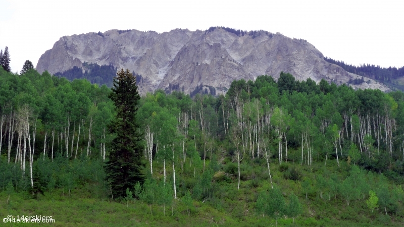 Marcellina standing above an aspen grove on the Ruby Anthracite Trail.