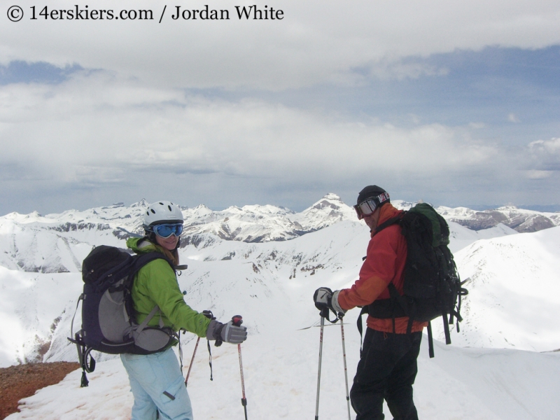 Brittany Walker Konsella and Frank Konsella on top of Redcloud, ready to ski. 