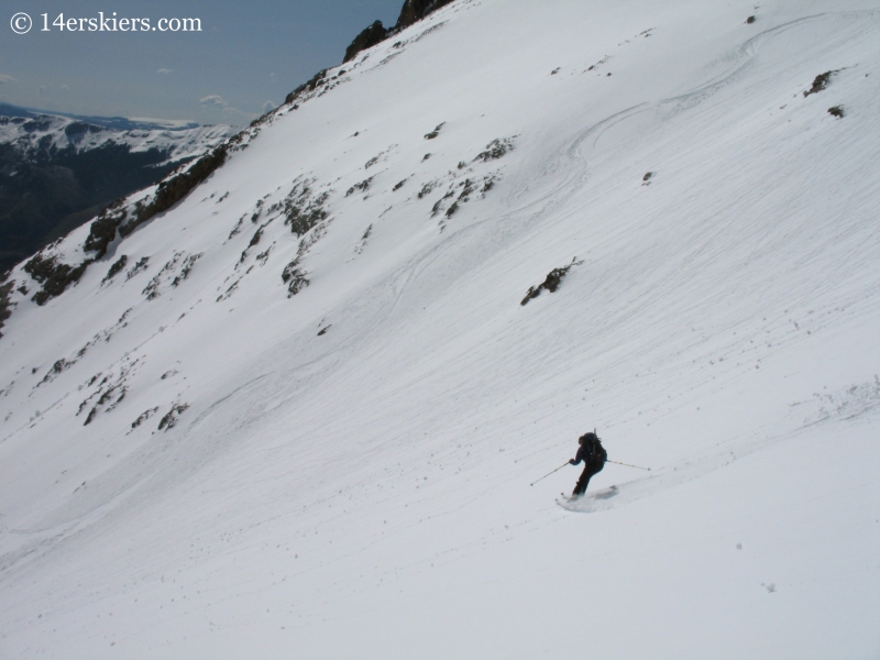 Jordan White backcountry skiing on Sunshine Peak.