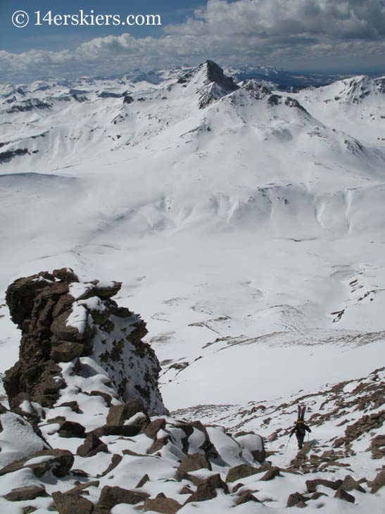 Scott Yost hiking Uncompahgre with Wetterhorn behind.