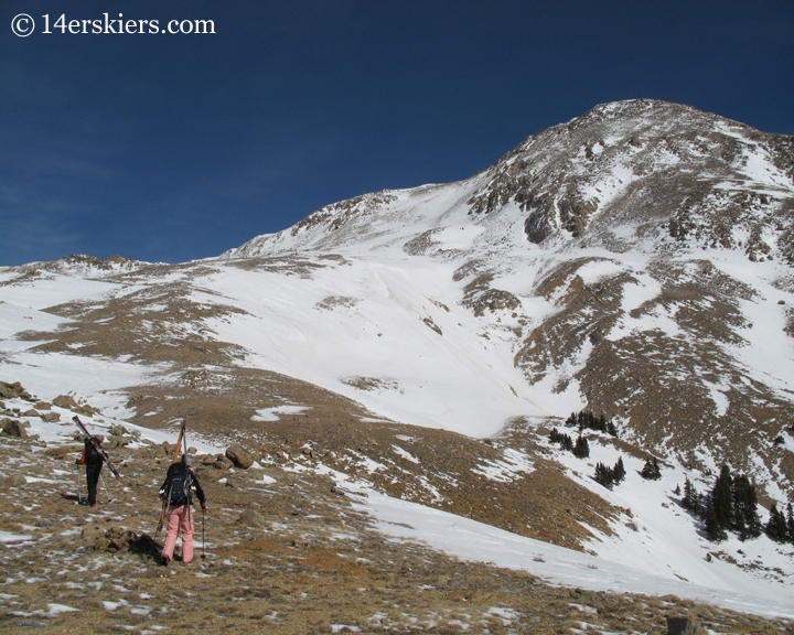 Climbing Mount Yale in winter to go backcountry skiing.