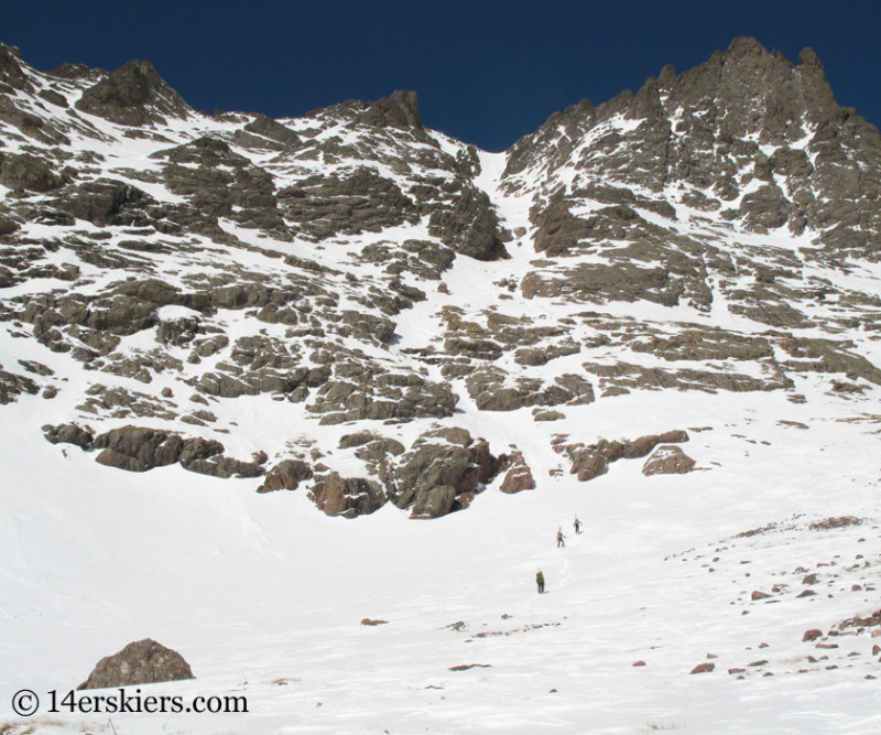 Climbing Crestone Peak south couloir to go backocuntry skiing.