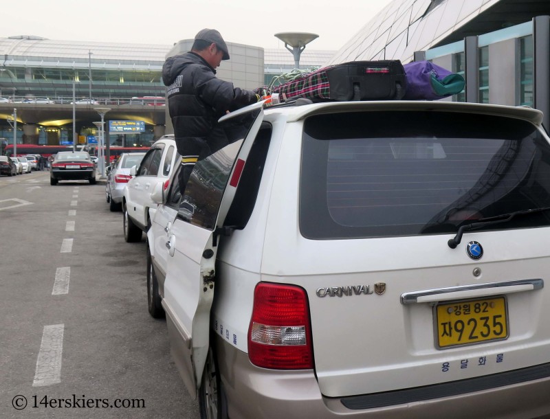 tying skis to minivan in South Korea!