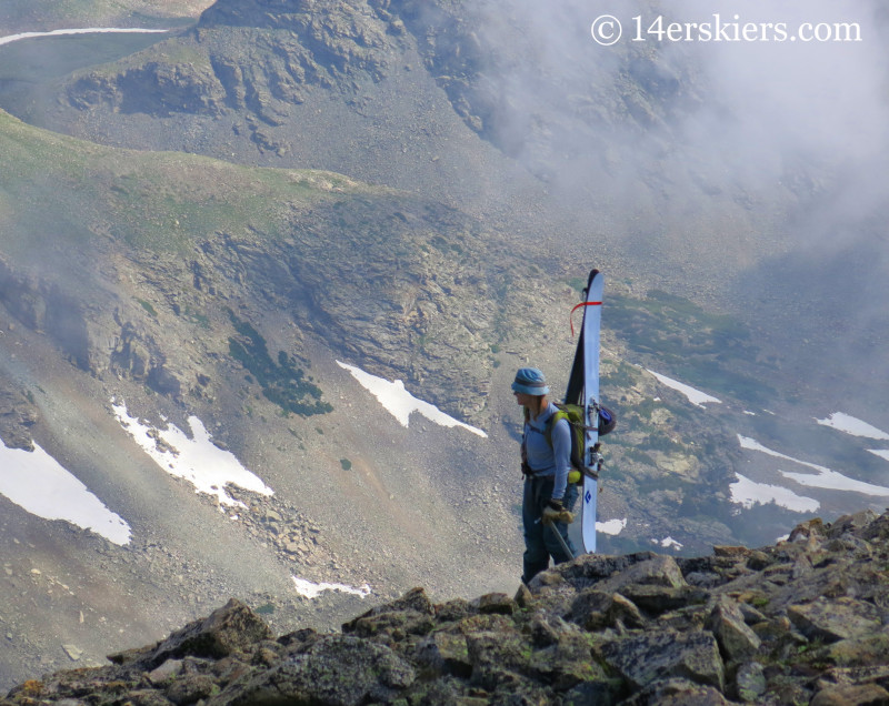 Brittany Konsella checking out alternate lines on Mount Audubon with Carbon Megawatts on her back. 