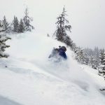 Backcountry snowboarding on a powder day.